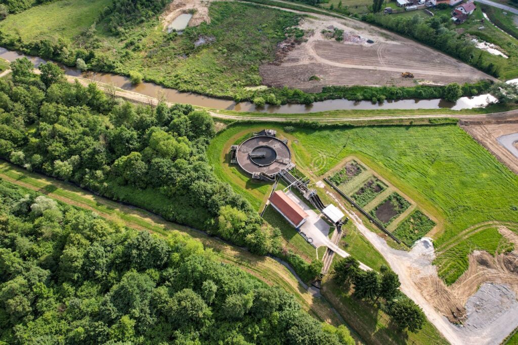 Aerial shot of a wastewater treatment plant surrounded by lush greenery in Garešnica, Croatia.